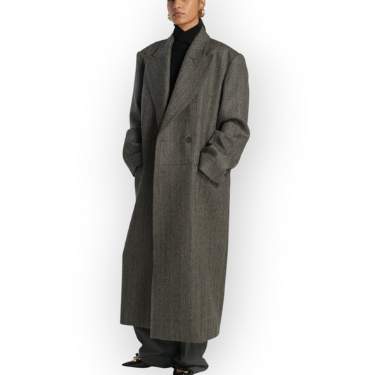 Model wearing a grey mélange Frenken Rework wool coat with structured shoulders and a high collar