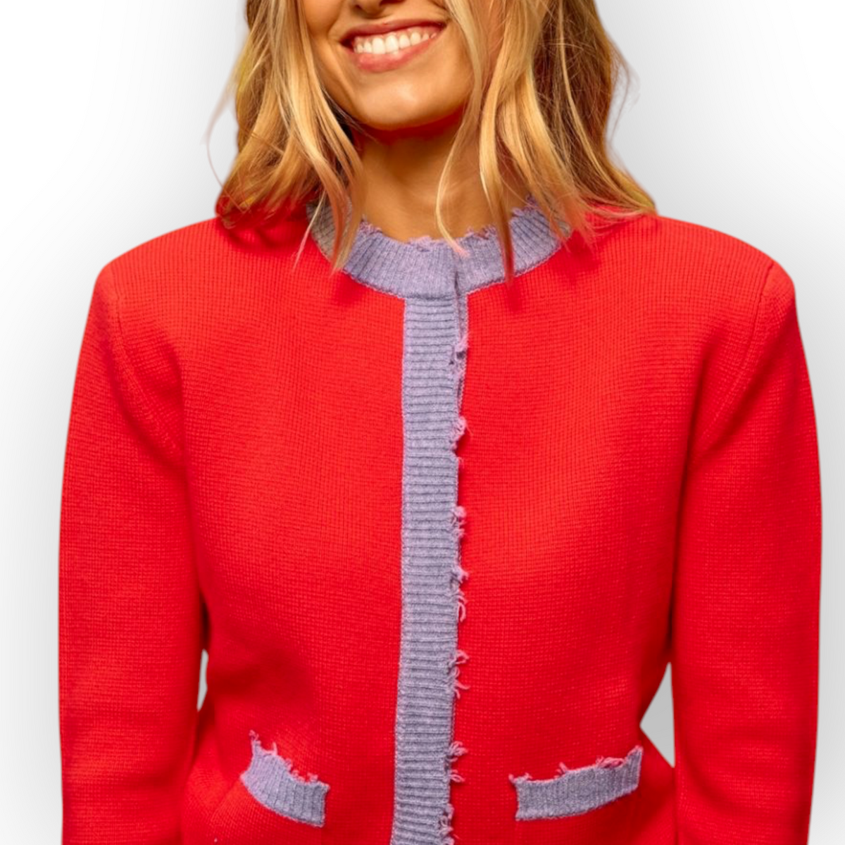 Ygreque Sea Me Happy Celeste cardigan in poppy red merino wool with contrasting lavender trim and front pockets
