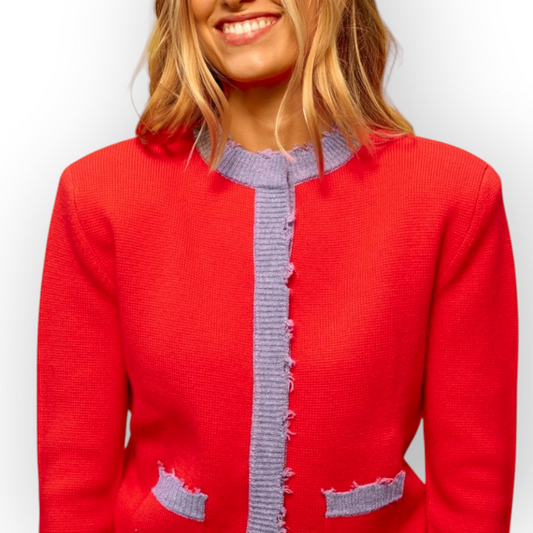 Ygreque Sea Me Happy Celeste cardigan in poppy red merino wool with contrasting lavender trim and front pockets