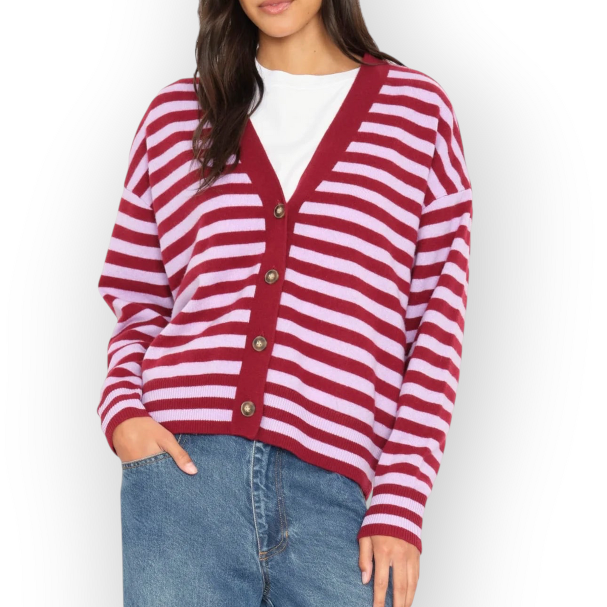 Model wearing a Ygreque Xirena Estelle cardigan in garnet and petal striped merino-cashmere blend with horn buttons.