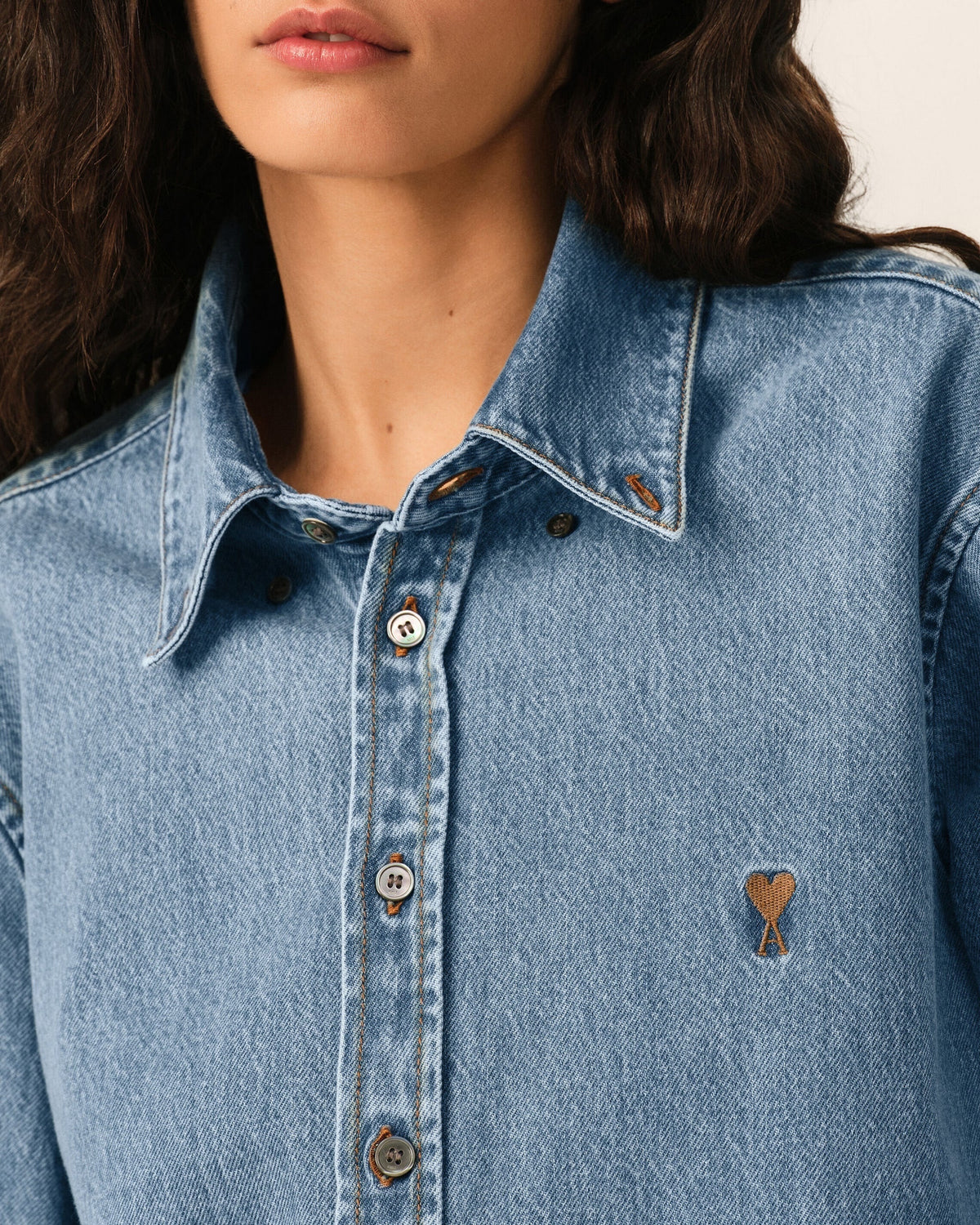 Ygreque Ami Paris light blue denim shirt with button-down collar and tobacco Ami de Coeur embroidery on chest