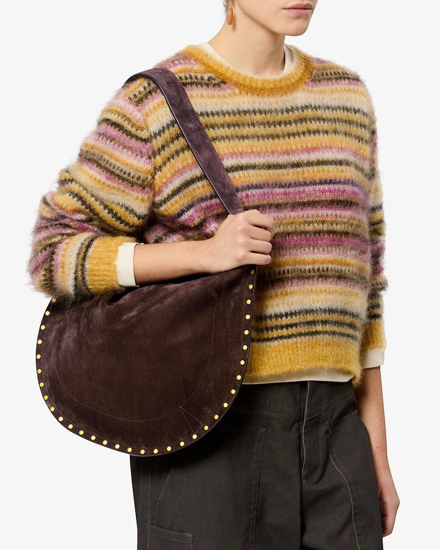 Ygreque Isabel Marant Oskan Hobo bag in coffee brown suede with gold rivet studs worn over the shoulder